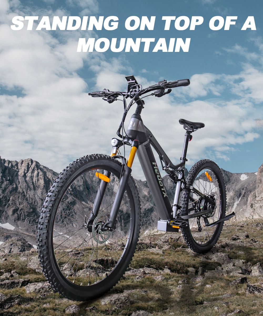 Elektrokolo Heda TX TX19, motor 1000 W, baterie 48 V 19,2 Ah, pneumatiky 29*2,4 palce, maximální rychlost 45 km/h, dojezd 70 km, hydraulické kotoučové brzdy, tlumící přední vidlice, barevný LCD displej, řazení Shimano 27 rychlostí - šedé